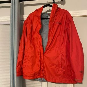 Bright coral colored raincoat